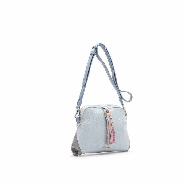 Stylish trapezoidal crossbody bag with multicolor tassel and adjustable strap.
