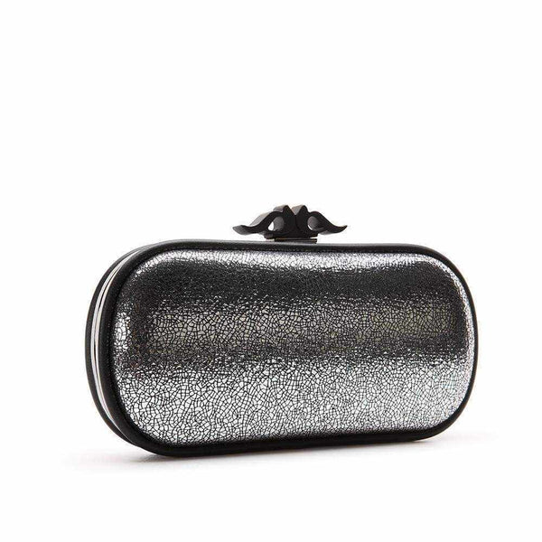 Lyli cocktail clutch with metallic cracked finish and cross-strap.