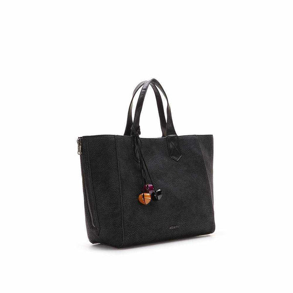 Reversible Mira Bag with double hand strap and removable crossbody strap, smooth granulated exterior.