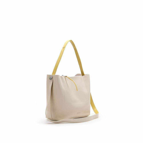 Trendy Chergui hobo bag with cross-strap and removable inner bag, minimalist design.