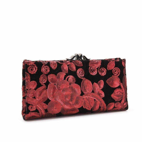 Elegant Blake cocktail clutch in velvet with sequin embroidery and metallic closure.