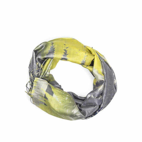 Grey scarf with ombre yellow leaf print and tassel trim.