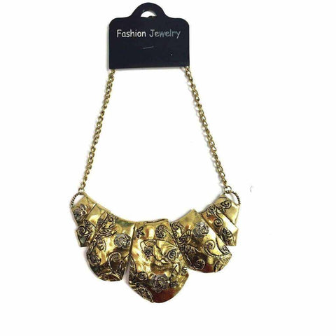 Gold floral necklace with intricate details on a metal chain.