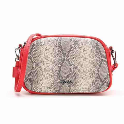 Snake-inspired Lia Crossbody Bag with leather strap in red.