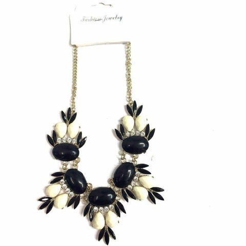 Monochrome necklace with black and white beads and diamante detail.