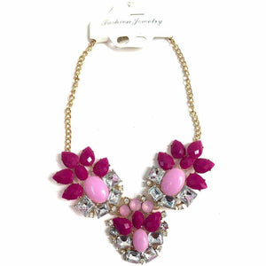 Pink diamante necklace on gold chain.