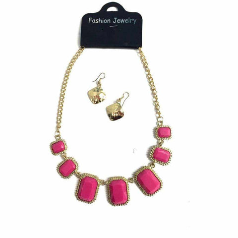 Pink stone necklace and earring set on gold chain.