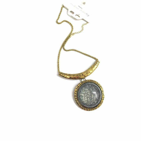 Single gemstone necklace with gold chain pendant.